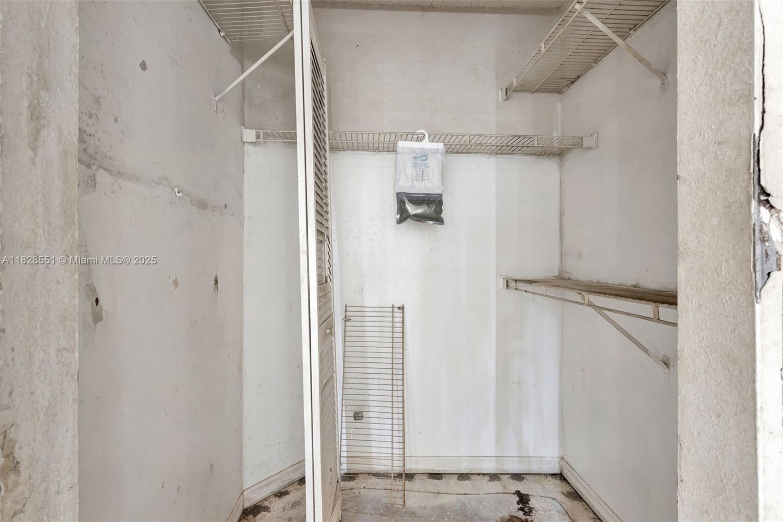 4055 West McNab Road, Unit H103 Pompano Beach, FL 33069 - Photo 15 of 21 a view of walk in closet