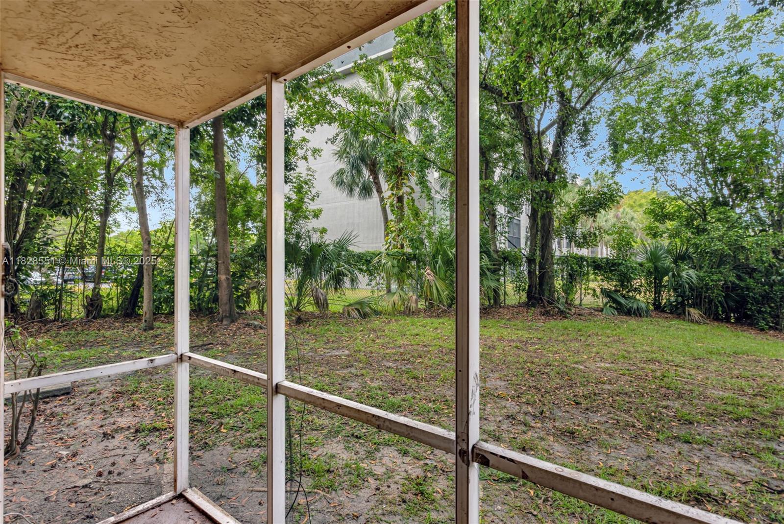 4055 West McNab Road, Unit H103 Pompano Beach, FL 33069 - Photo 17 of 21 a view of a backyard