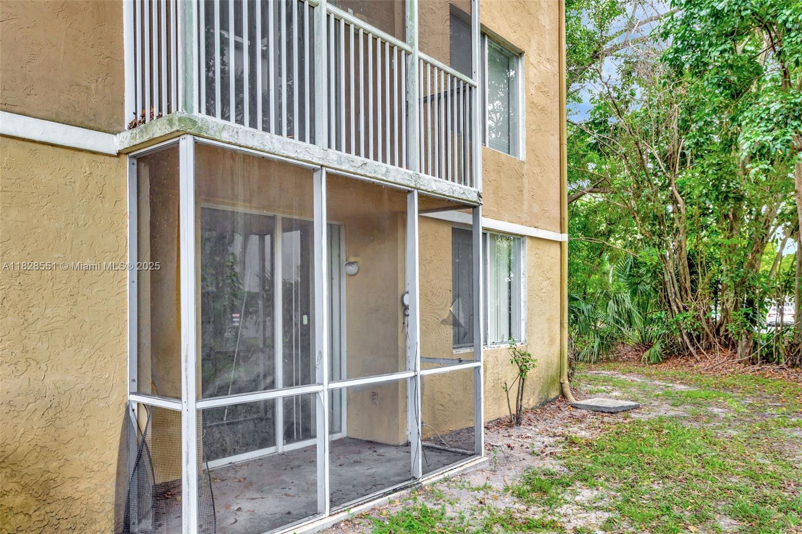 4055 West McNab Road, Unit H103 Pompano Beach, FL 33069 - Photo 20 of 21 a view of a house with a street
