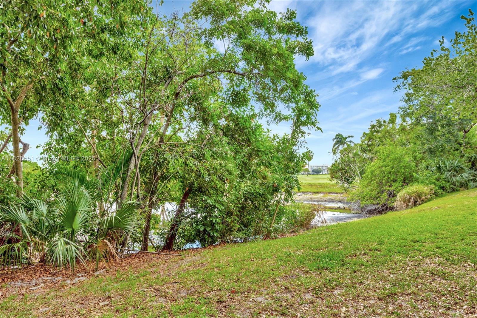 4055 West McNab Road, Unit H103 Pompano Beach, FL 33069 - Photo 21 of 21 a view of yard with green space