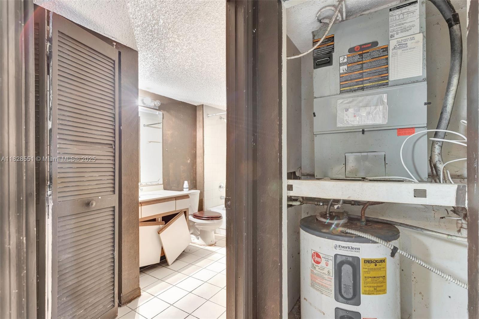 4055 West McNab Road, Unit H103 Pompano Beach, FL 33069 - Photo 9 of 21 a bathroom with a sink and a mirror