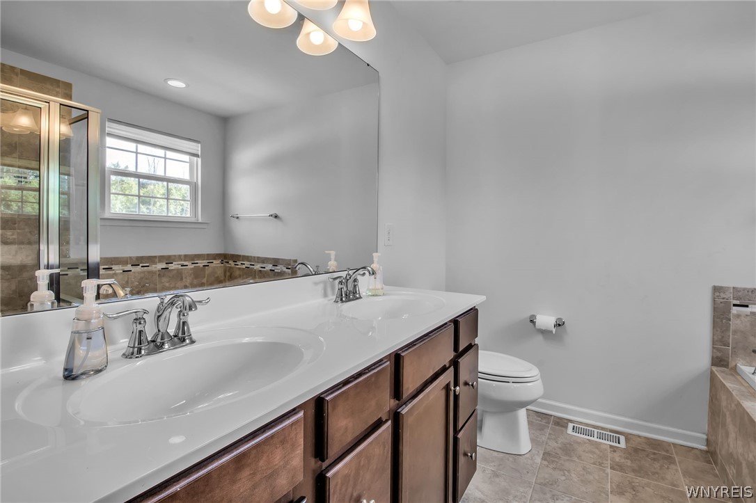 4978 Cloverleaf Lane Pendleton, NY 14094 - Photo 17 of 41 Primary bath has a double vanity for busy mornings