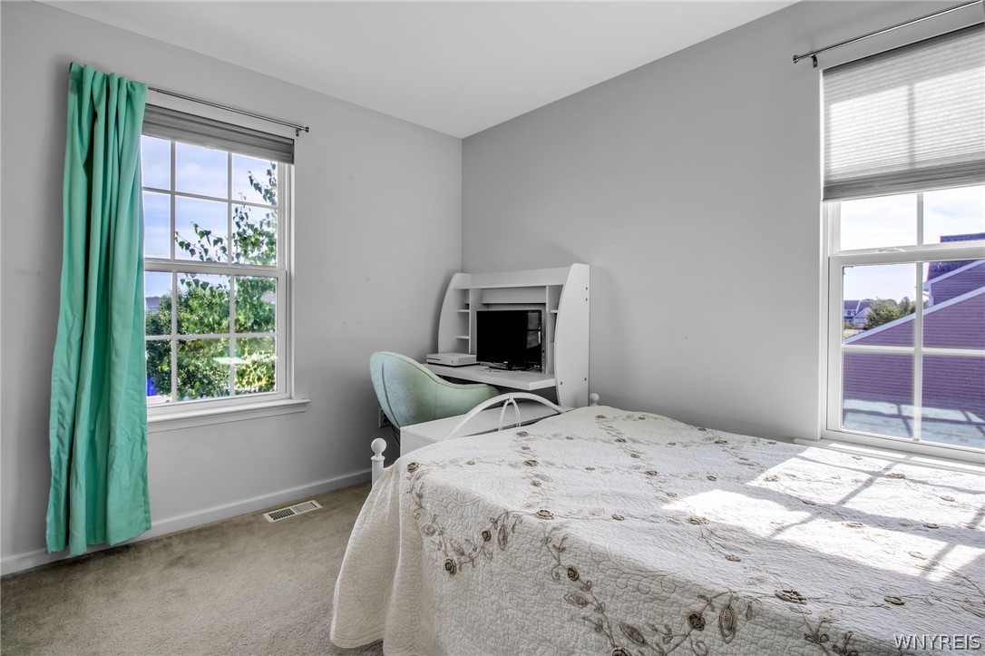 4978 Cloverleaf Lane Pendleton, NY 14094 - Photo 24 of 41 This bedroom is at the corner of the house so wind