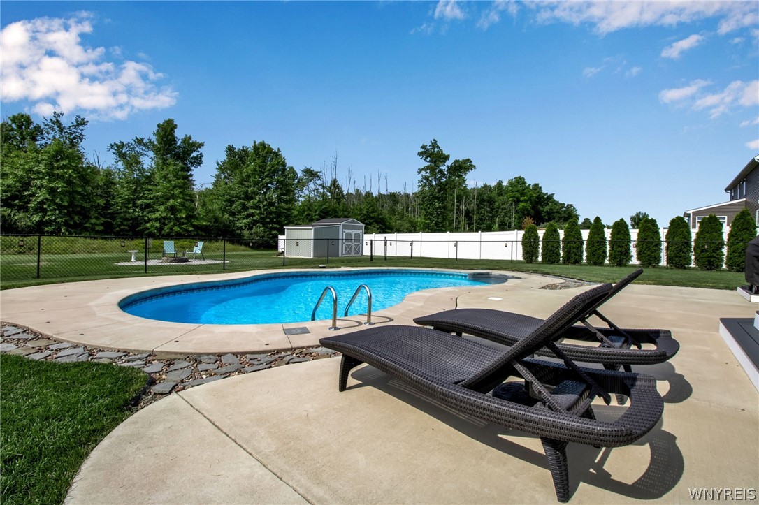 4978 Cloverleaf Lane Pendleton, NY 14094 - Photo 34 of 41 Great shot of pool and lounge area.