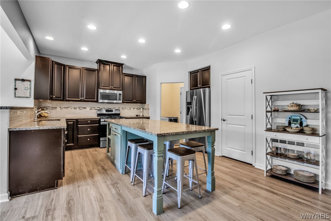 4978 Cloverleaf Lane Pendleton, NY 14094 - Photo 9 of 41 The granite 8-foot island is perfect for eating an