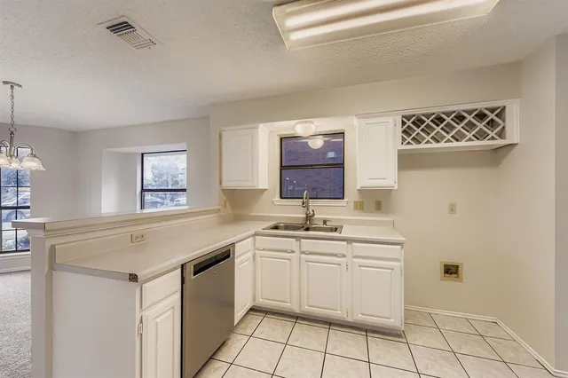 a kitchen with stainless steel appliances a refrigerator and a sink