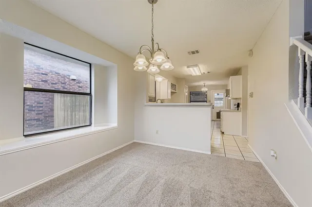 a view of a kitchen with a sink and cabinets