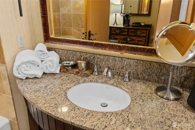 a bathroom with a sink and a mirror