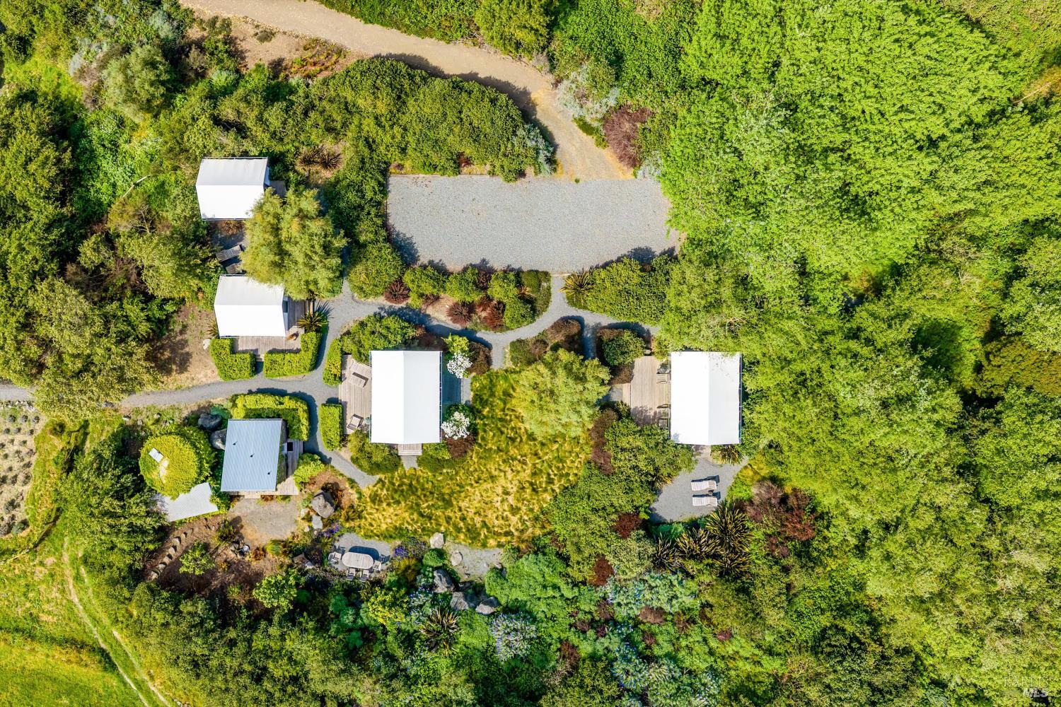 4707 Bloomfield Road Petaluma, CA 94952 - Photo 49 of 97 4 Seasonal safari tent cabins. Detached 2 room bath house with 2 bathrooms, outdoor shower, kitchen and laundry cabin. Sauna, Bocce Ball court and cold plunge tub.