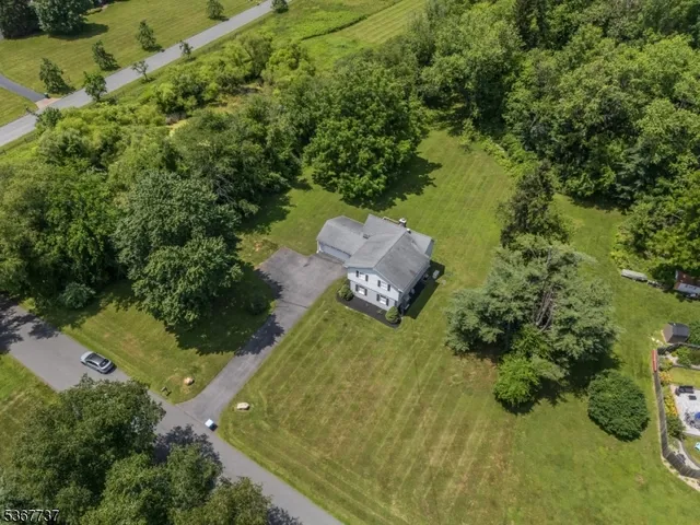 a aerial view of a house with a yard