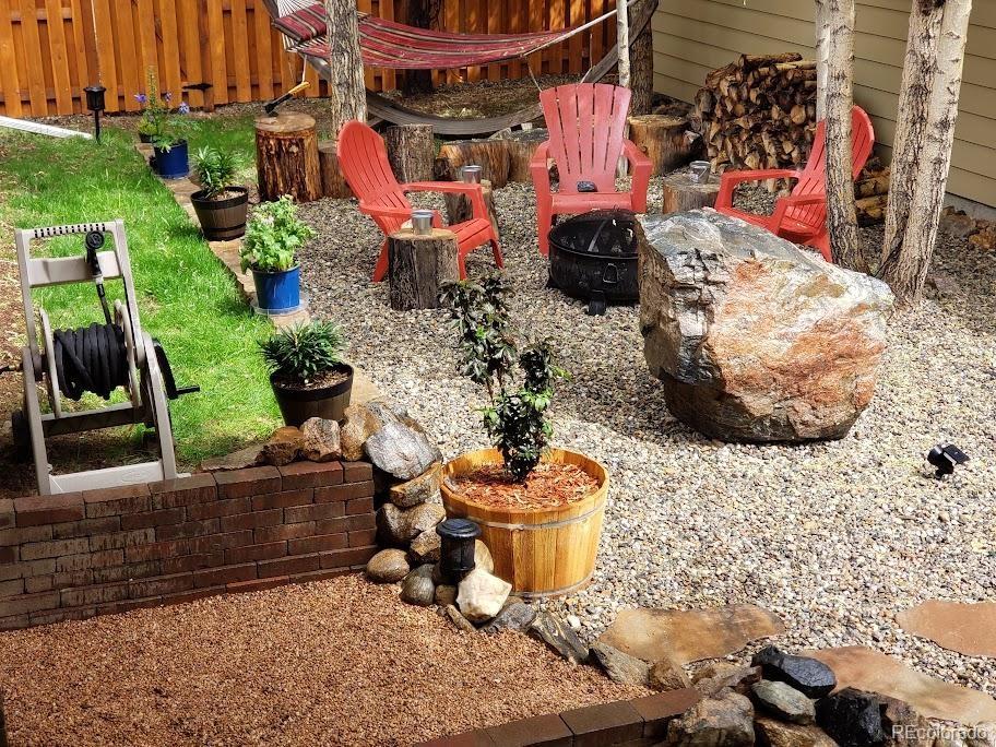 1418 Rose Street Georgetown, CO 80444 - Photo 12 of 33 a view of a patio with table and chairs potted plants