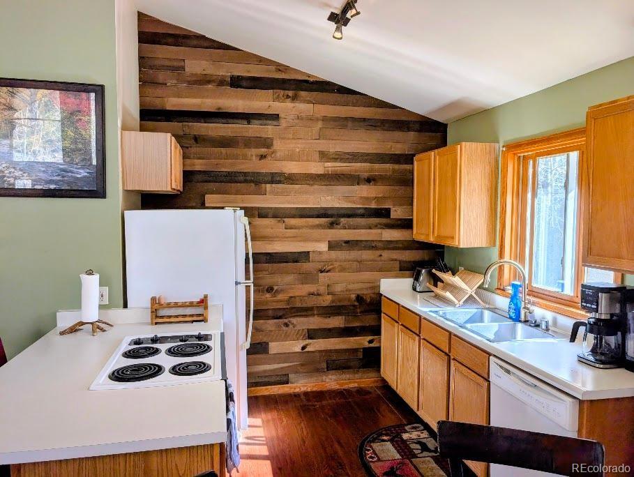 1418 Rose Street Georgetown, CO 80444 - Photo 23 of 33 a kitchen with a sink stove and cabinets