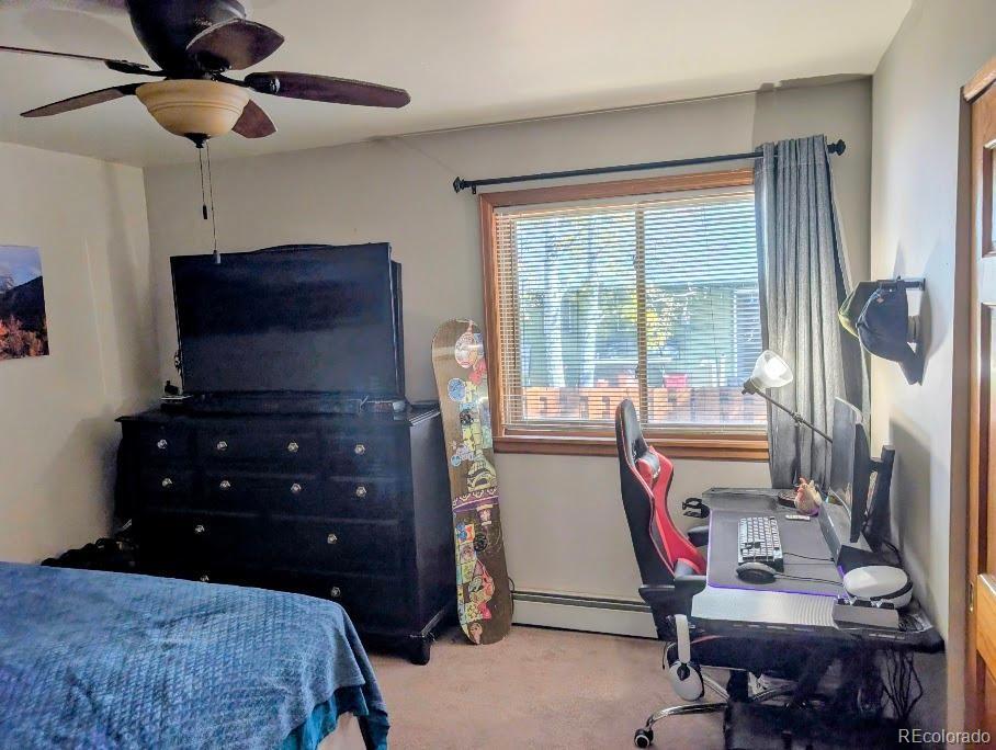 1418 Rose Street Georgetown, CO 80444 - Photo 29 of 33 a bedroom with a bed and a window