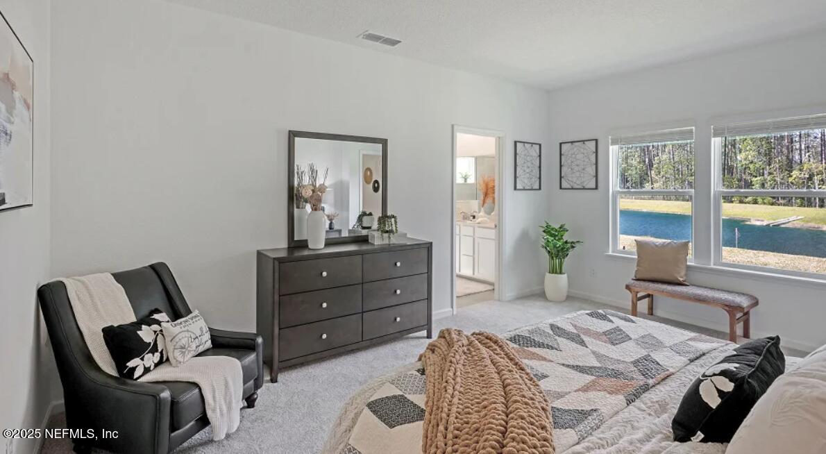 606 Kingbird Drive St. Augustine, FL 32092 - Photo 12 of 14 a bedroom with a bed and window