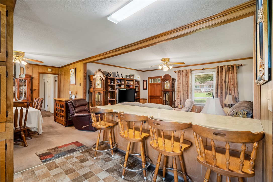 312 Edwards Drive Anderson, SC 29626 - Photo 12 of 44 An inviting eat-in kitchen with a breakfast bar seamlessly connects to a cozy living area.