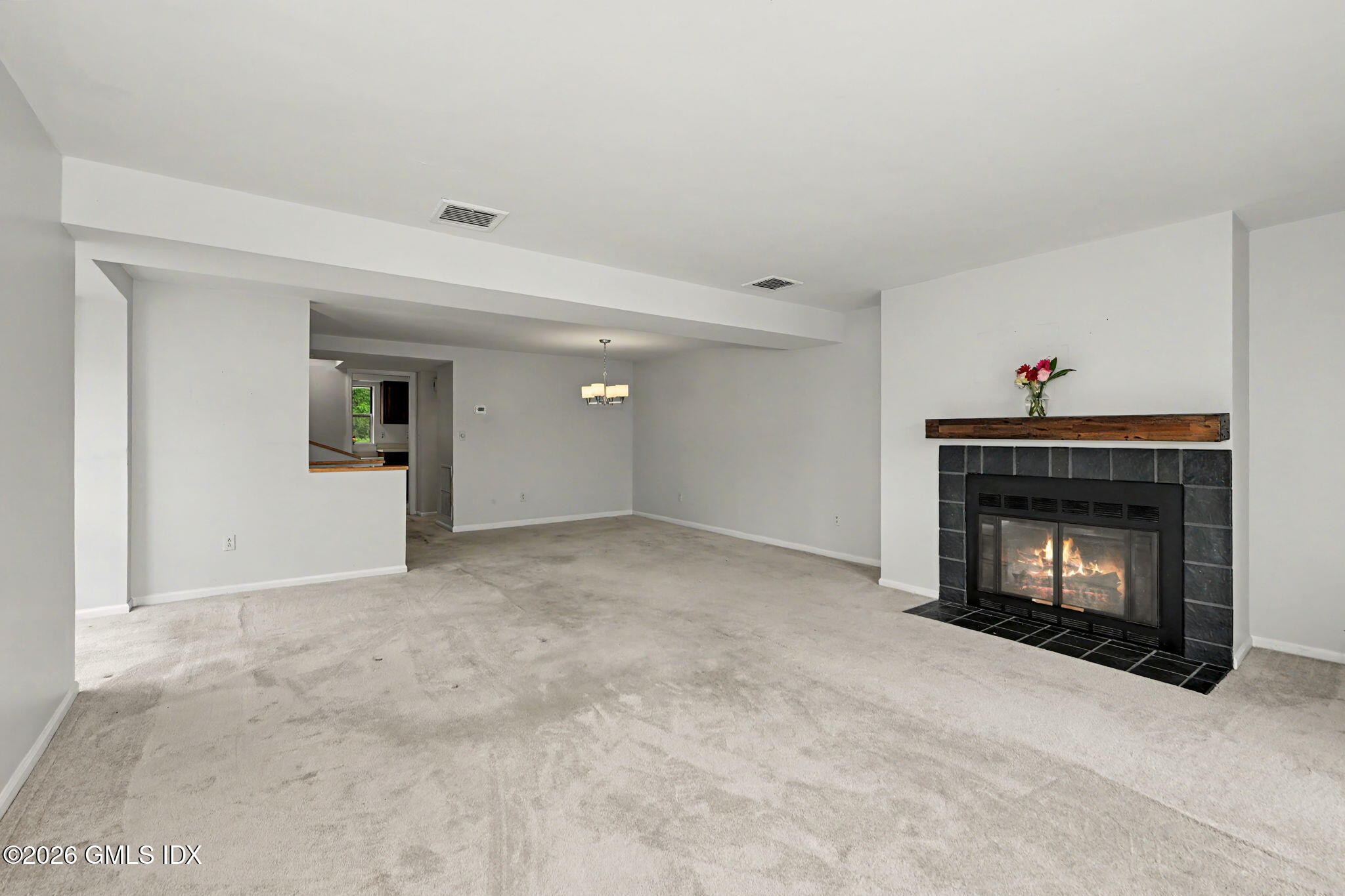 21 Highland Road, Unit 21 Stamford, CT 06901 - Photo 3 of 19 Living Room/Dining Area with Fireplace