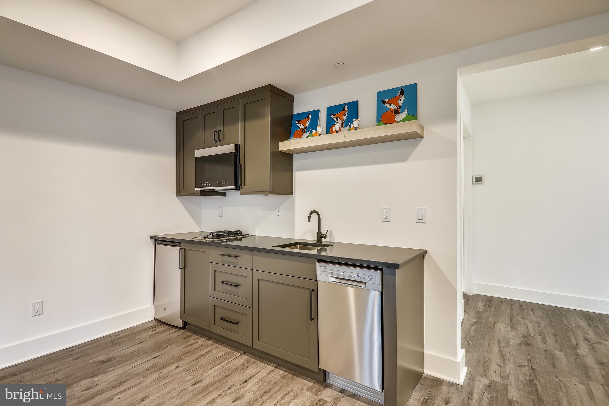 8727 Burning Tree Road Bethesda, MD 20817 - Photo 71 of 85
Lower Level Rec Room with Wet Bar