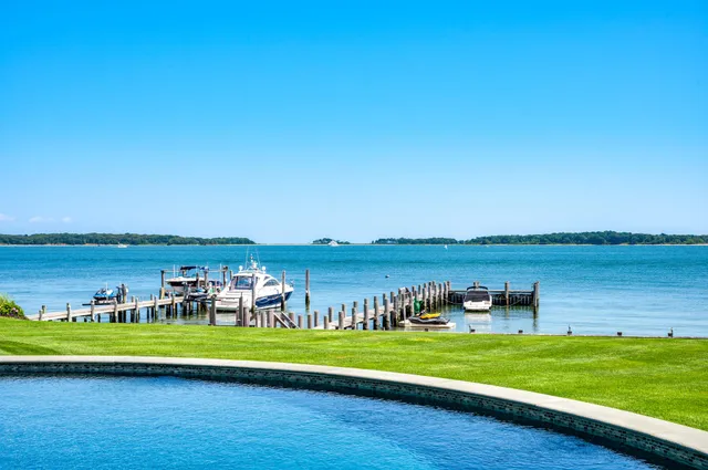 a view of a lake with houses in the back