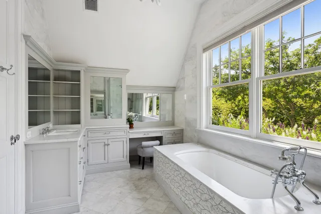 a bathroom with a bathtub and a sink