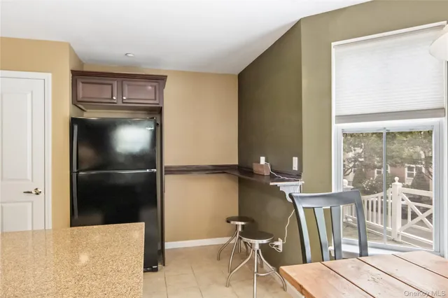 a view of a two chairs and table in the deck