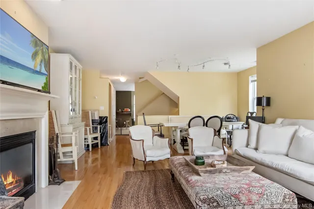 a bathroom with a granite countertop sink toilet a large mirror and bathtub