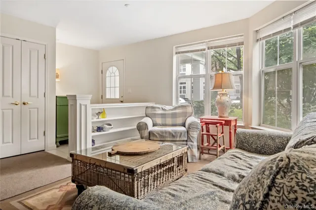 a kitchen with a refrigerator a stove top oven and a large window