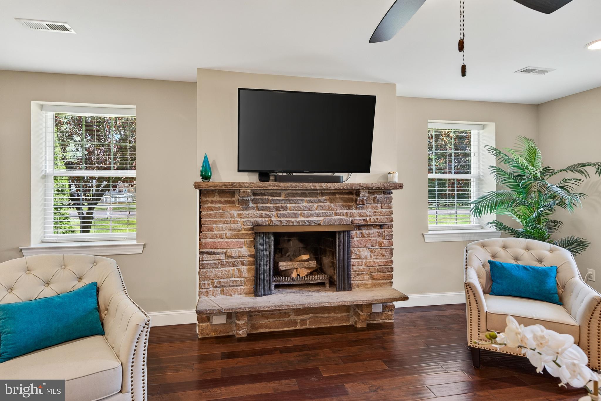 246 Oak Park Road Hatfield, PA 19440 - Photo 11 of 45 a living room with furniture flat screen tv and a fireplace