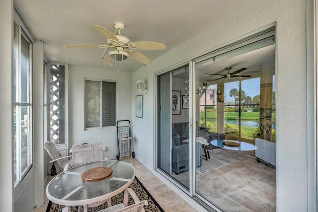 a bathroom with a sink a large mirror and a glass door shower