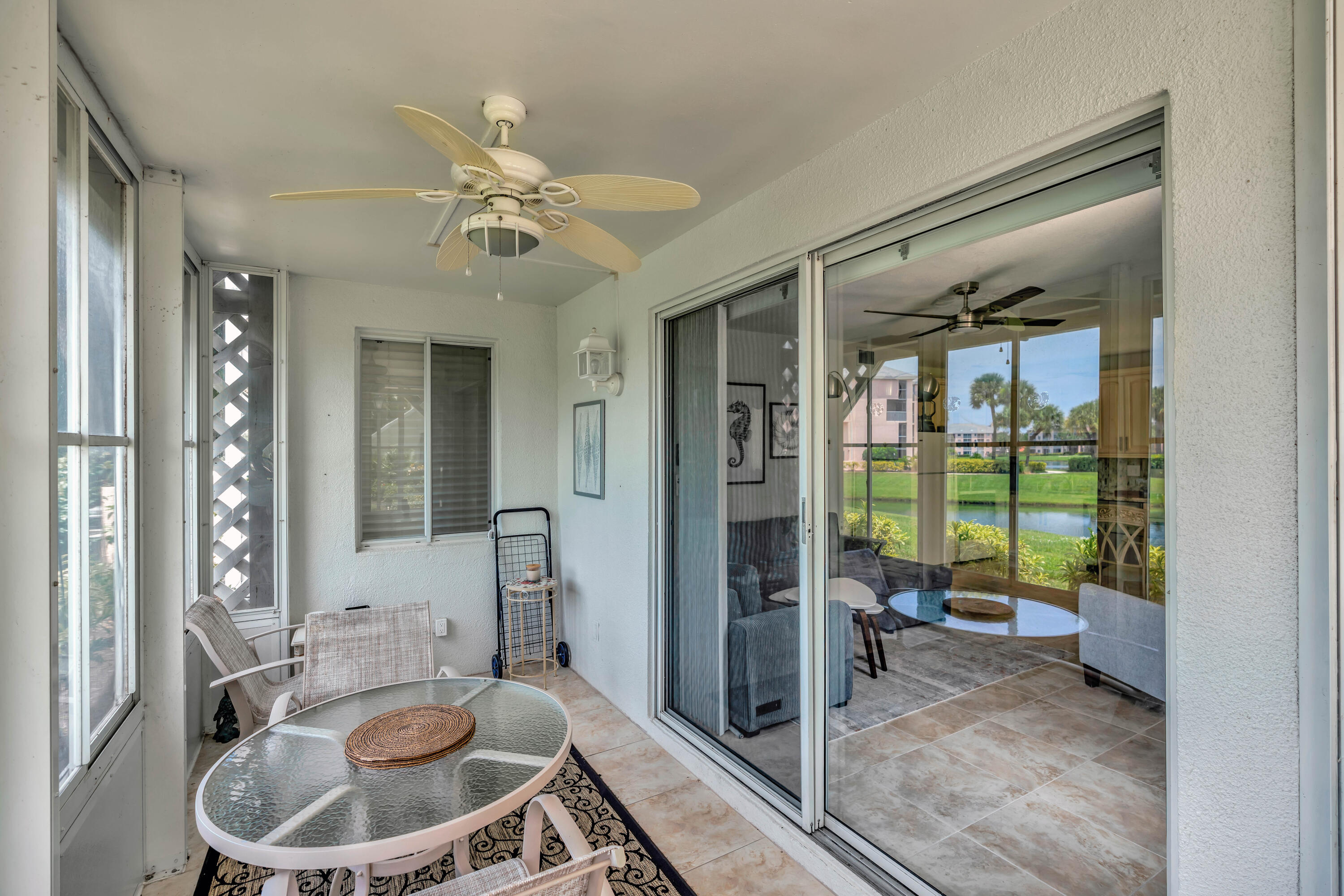 353 Highway 1, Unit A4 Jupiter, FL 33477 - Photo 16 of 51 a bathroom with a sink a large mirror and a glass door shower