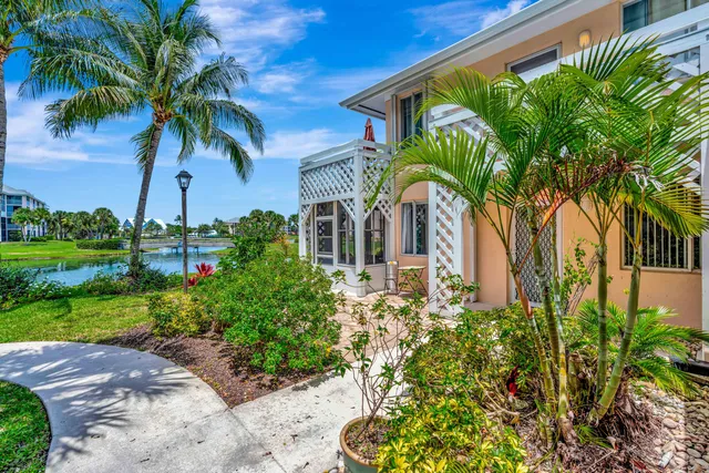 a view of a palm trees in front of a house