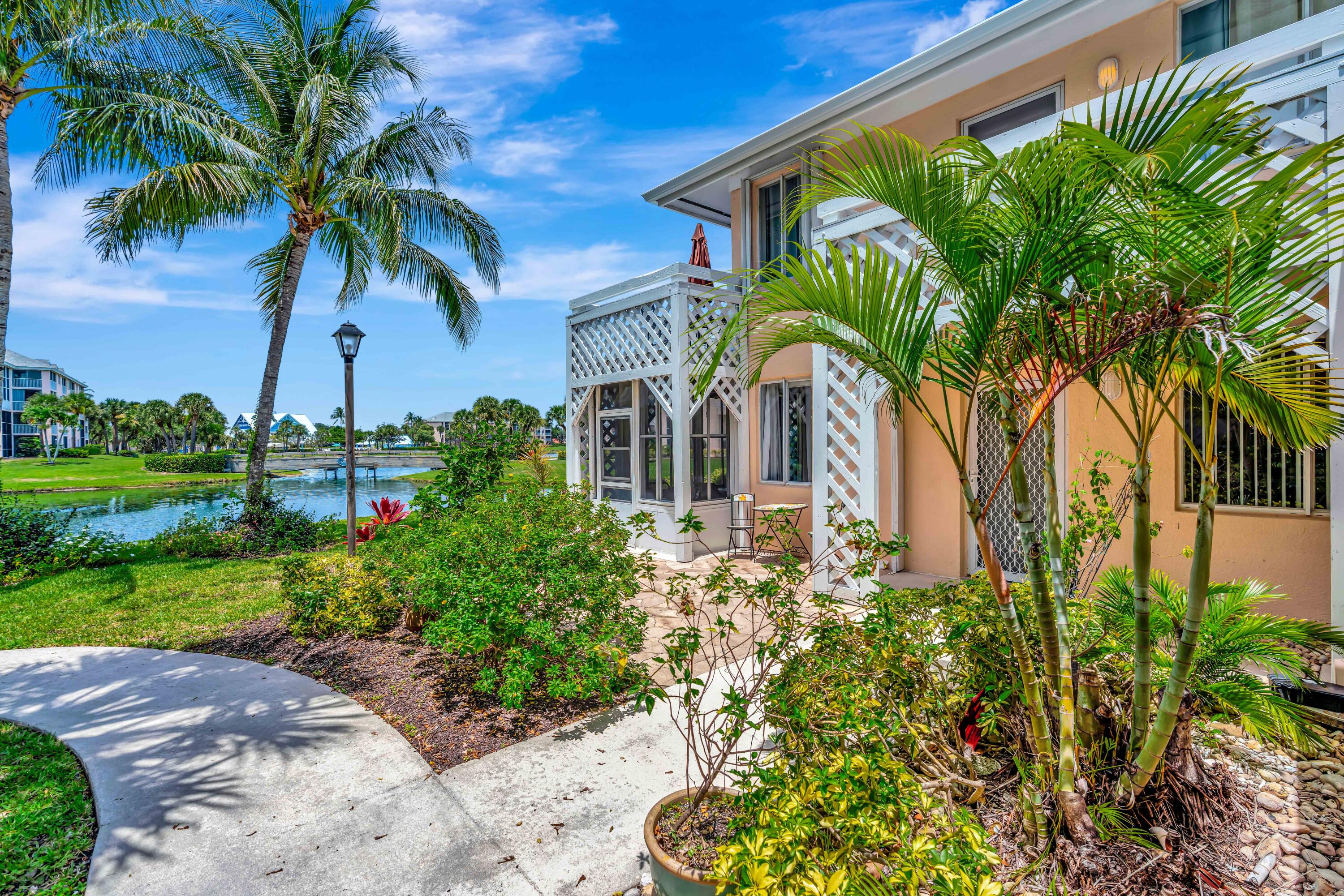 353 Highway 1, Unit A4 Jupiter, FL 33477 - Photo 20 of 51 a view of a palm trees in front of a house
