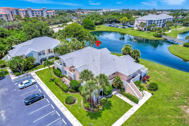 an aerial view of a house with a swimming pool yard and outdoor seating