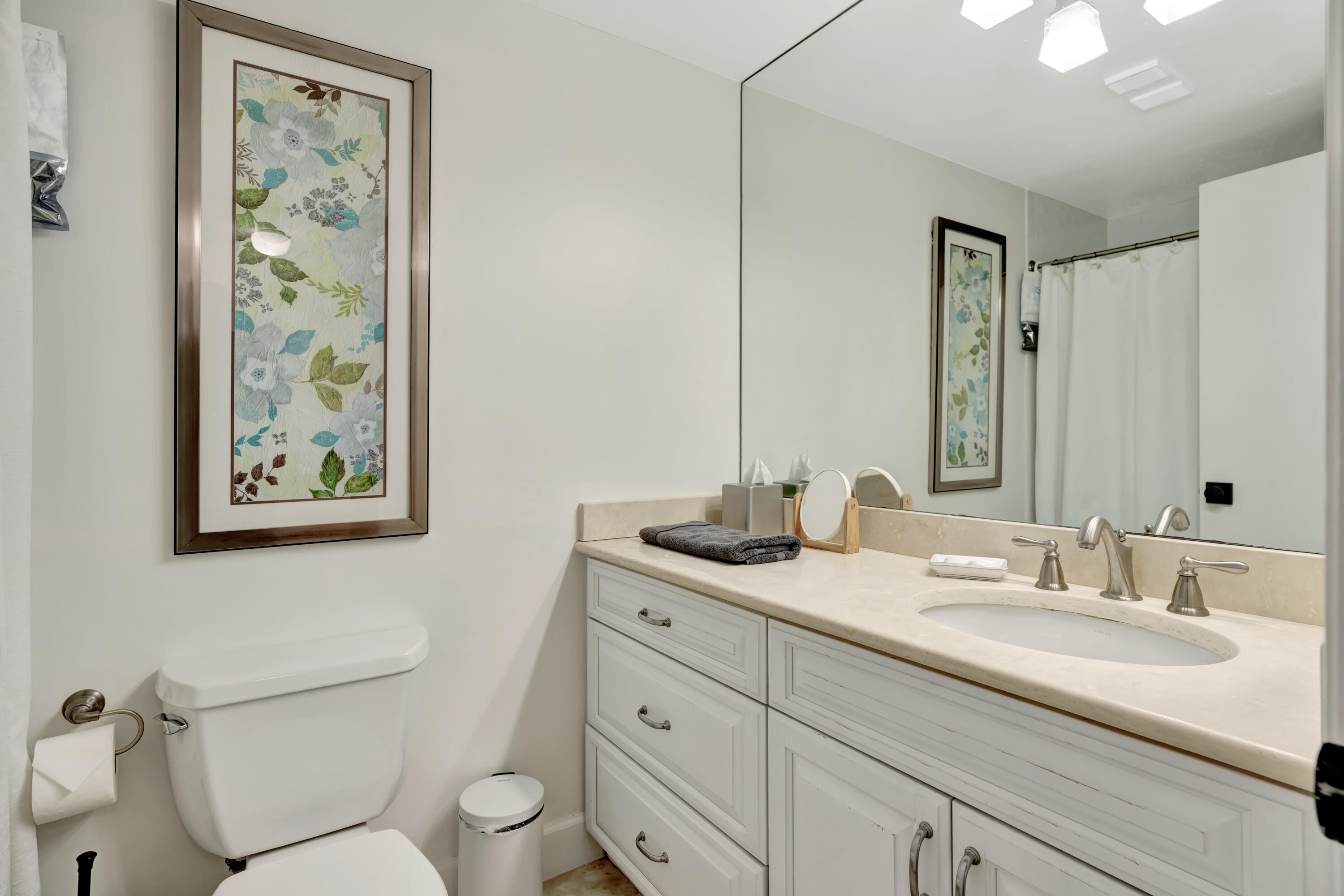 353 Highway 1, Unit A4 Jupiter, FL 33477 - Photo 28 of 51 a bathroom with a granite countertop sink toilet and a mirror