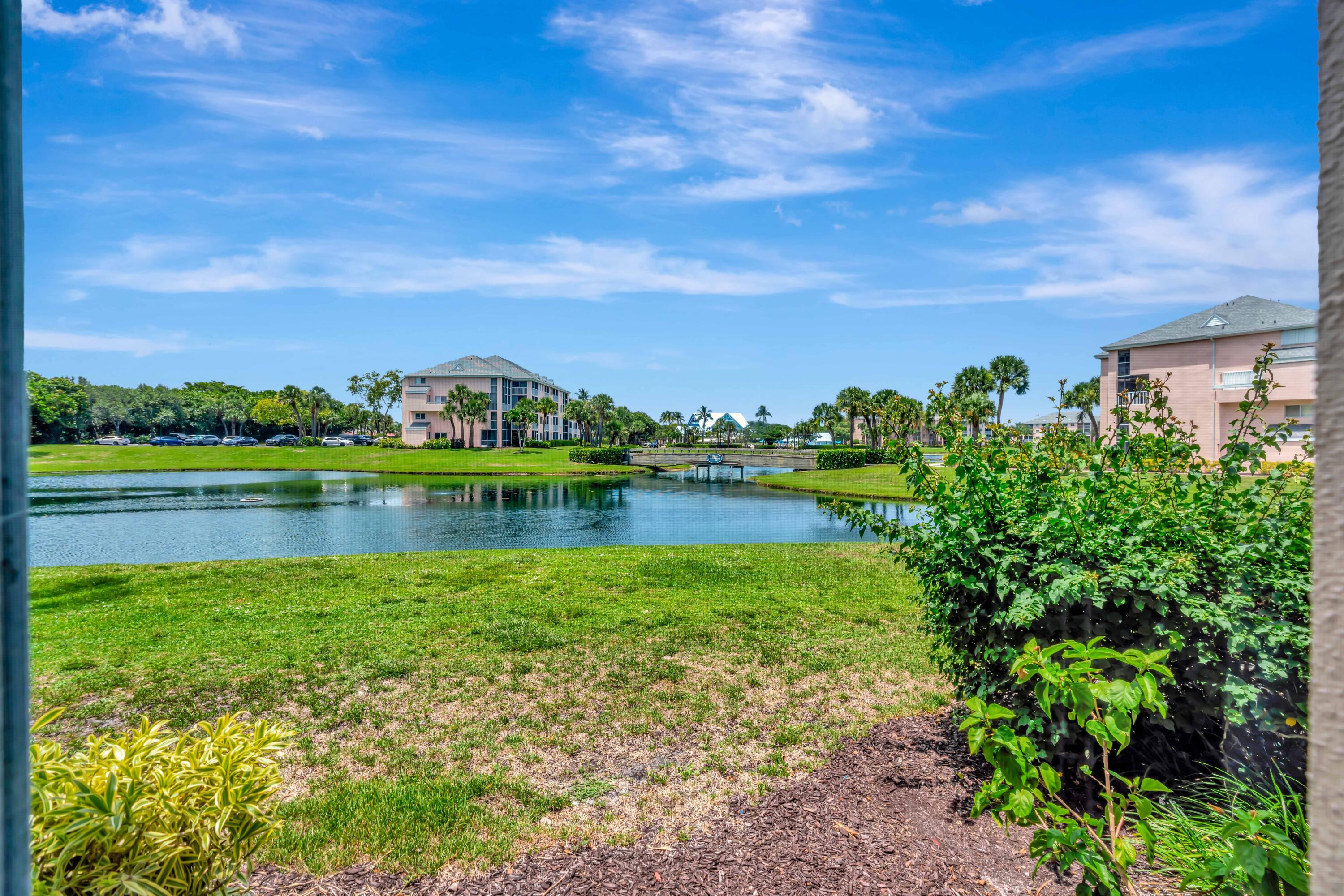 353 Highway 1, Unit A4 Jupiter, FL 33477 - Photo 31 of 51 a view of a lake with houses in the back
