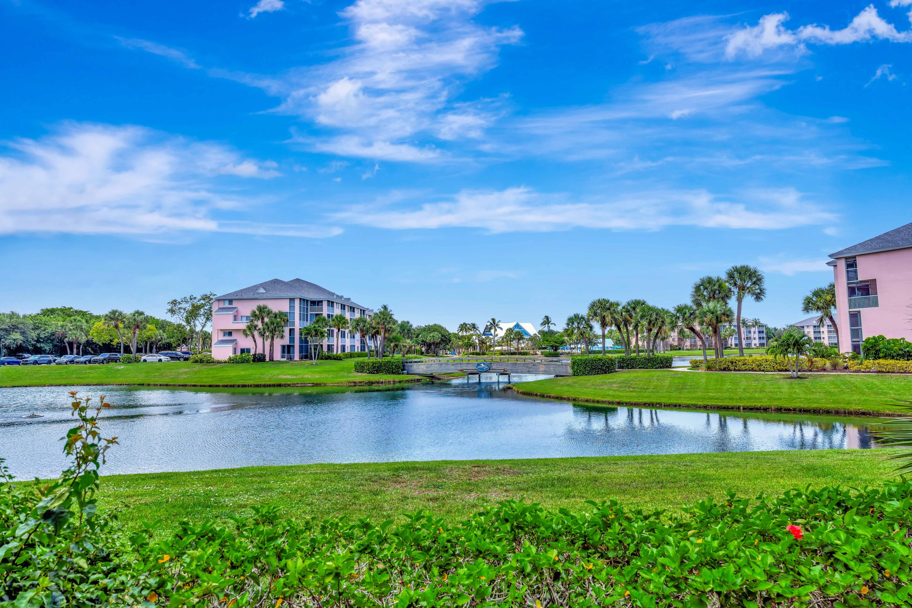 353 Highway 1, Unit A4 Jupiter, FL 33477 - Photo 33 of 51 a view of a garden with a house in the background
