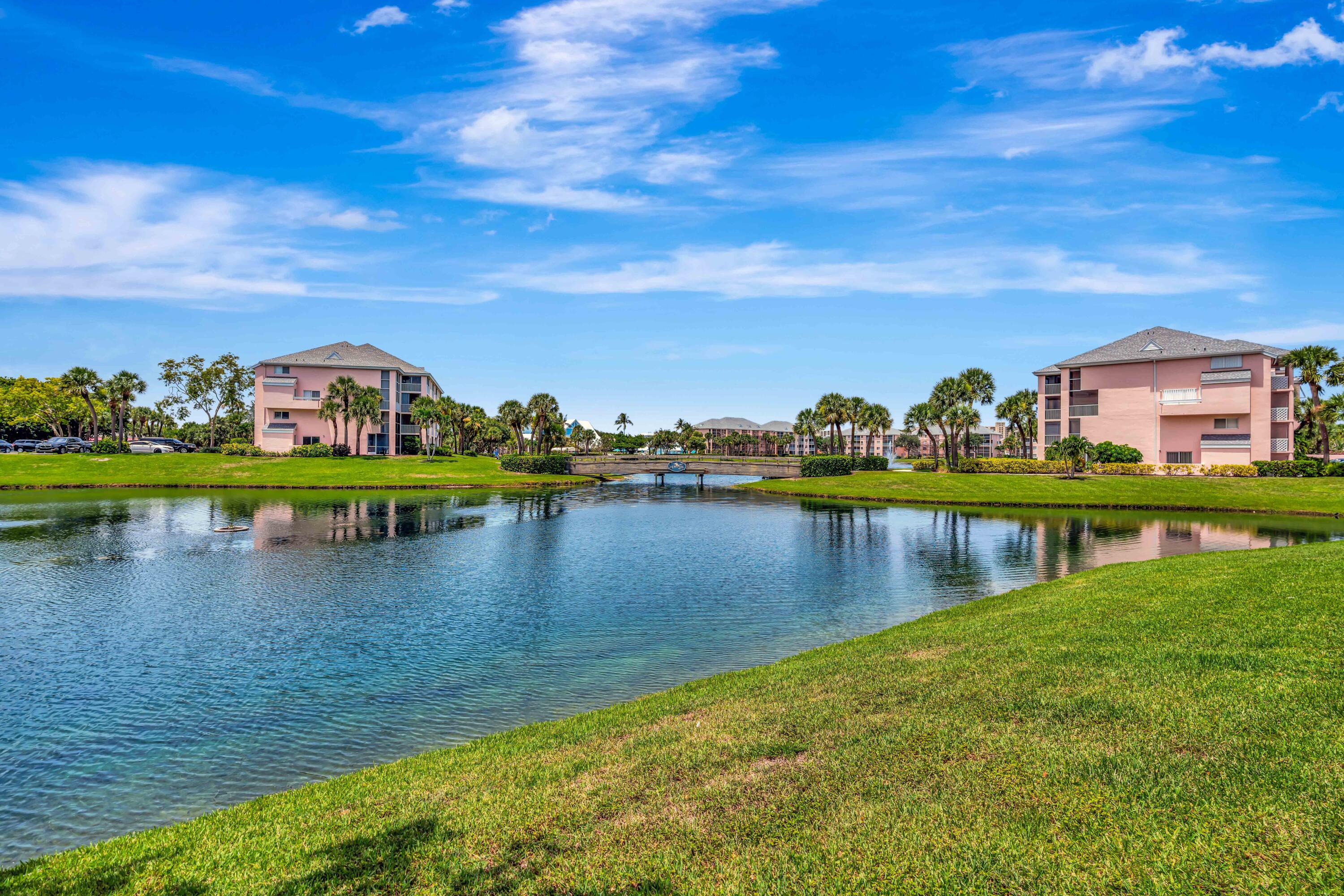 353 Highway 1, Unit A4 Jupiter, FL 33477 - Photo 36 of 51 a view of a lake with houses in the back