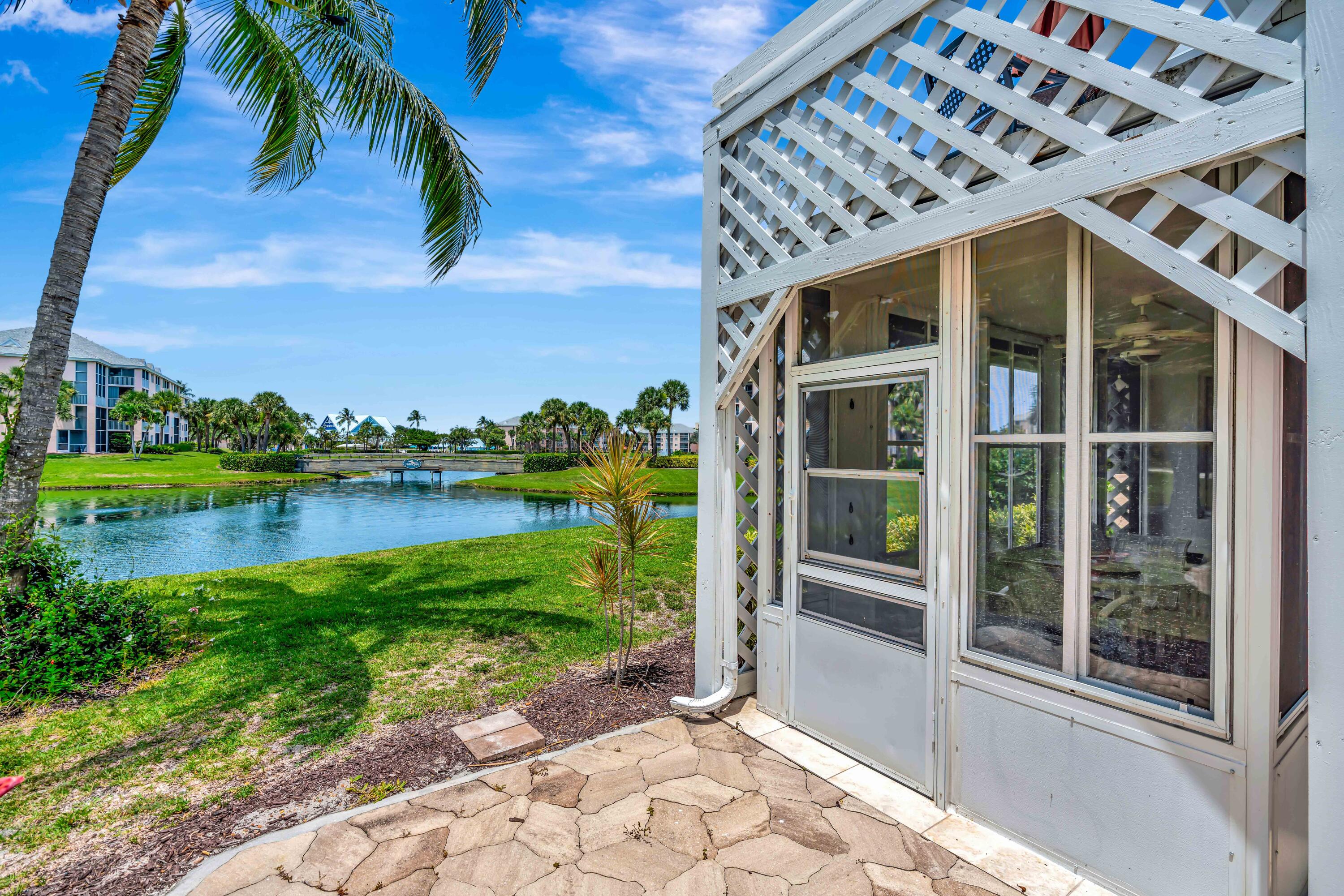 353 Highway 1, Unit A4 Jupiter, FL 33477 - Photo 38 of 51 a front view of a house with a yard