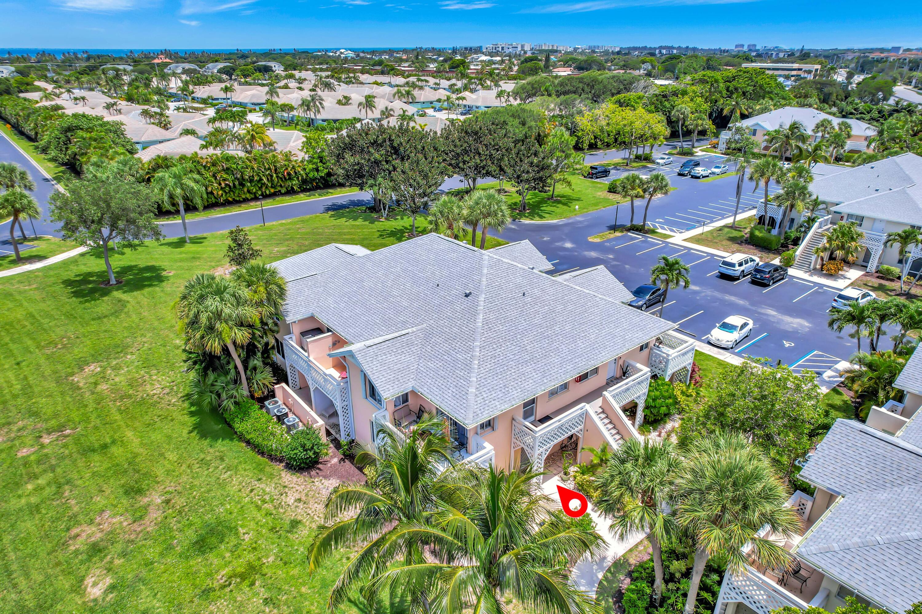 353 Highway 1, Unit A4 Jupiter, FL 33477 - Photo 40 of 51 an aerial view of a house with a yard swimming pool outdoor seating yard and mountain view in back