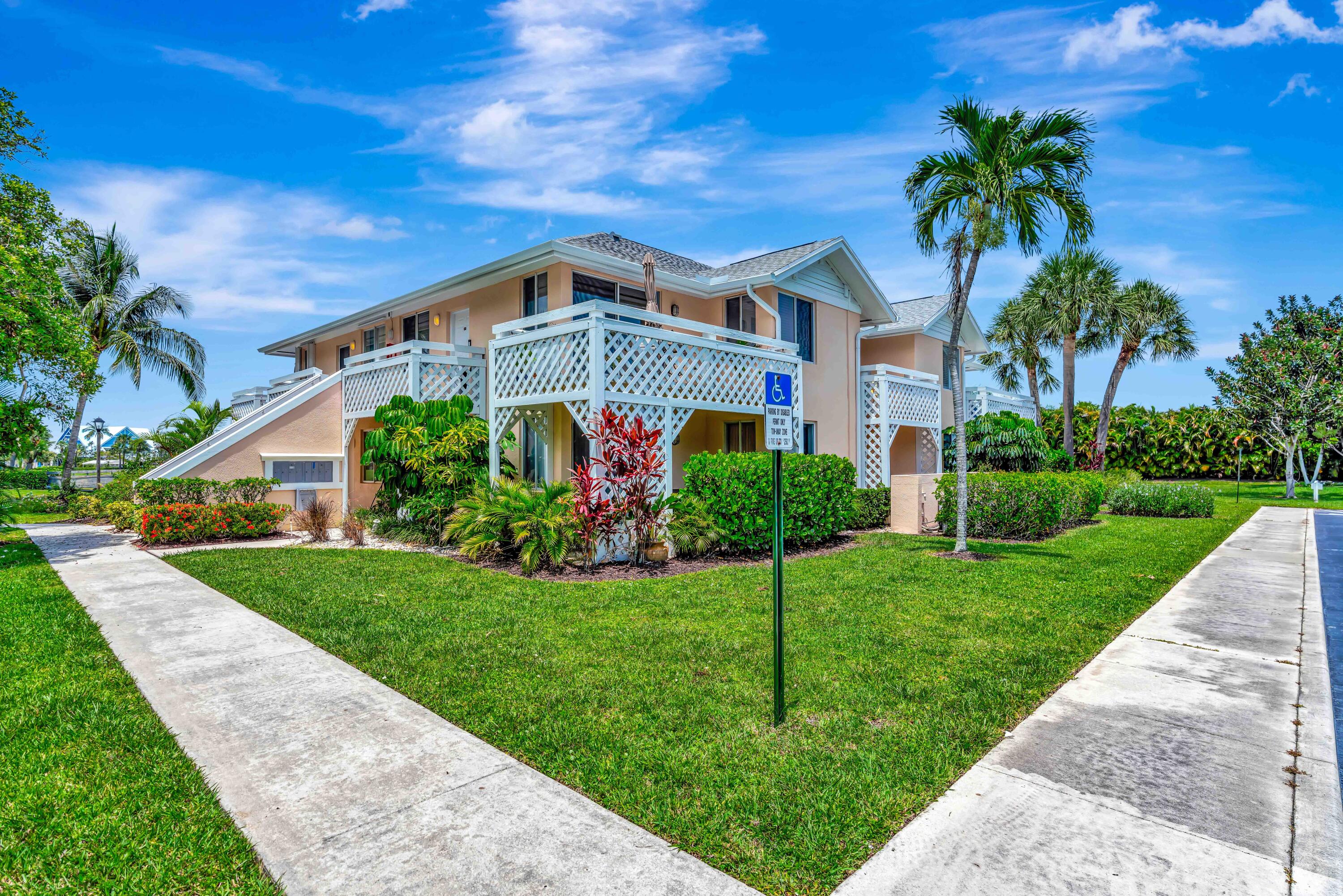 353 Highway 1, Unit A4 Jupiter, FL 33477 - Photo 44 of 51 a front view of a house with a yard