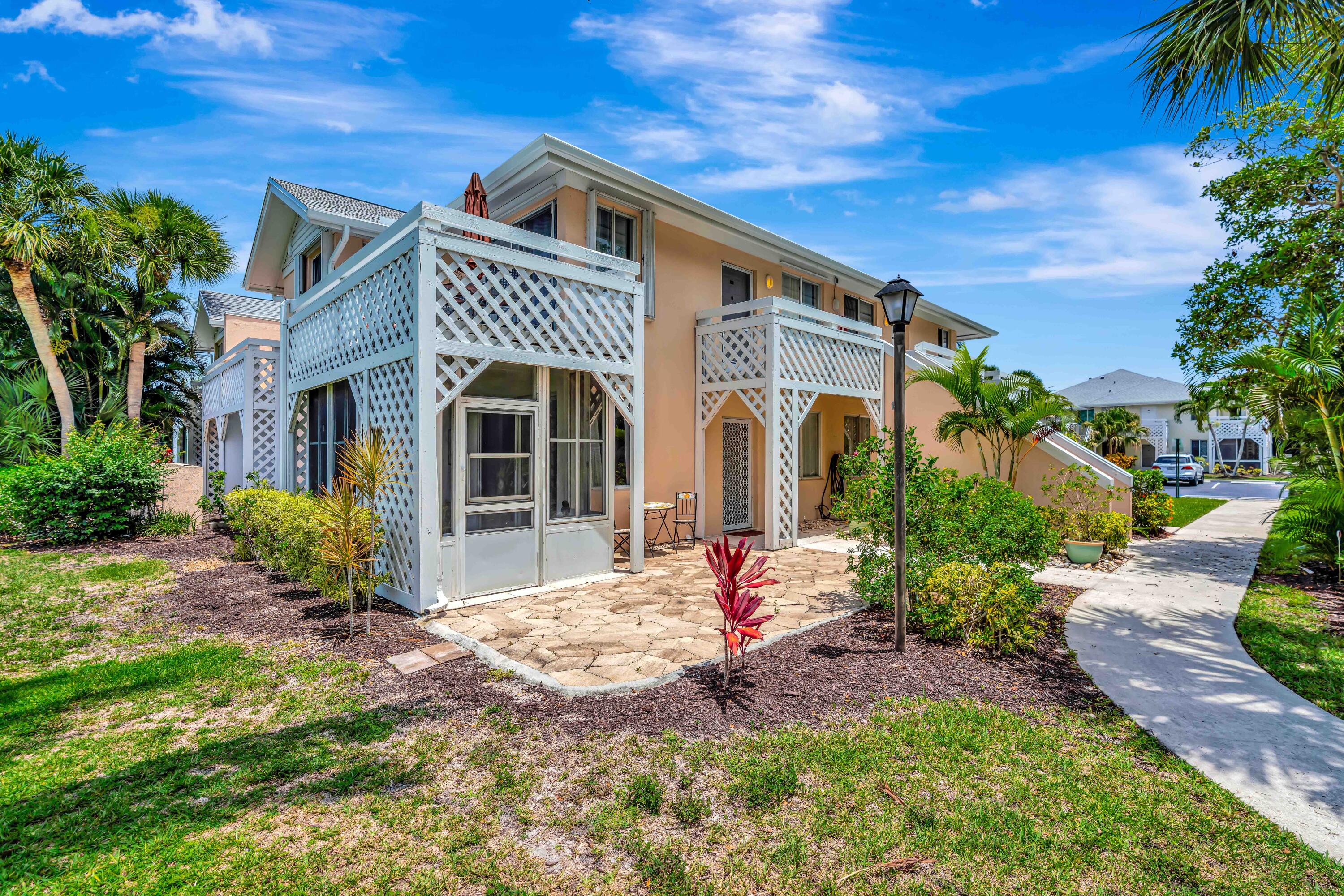 353 Highway 1, Unit A4 Jupiter, FL 33477 - Photo 45 of 51 a front view of a house with a yard