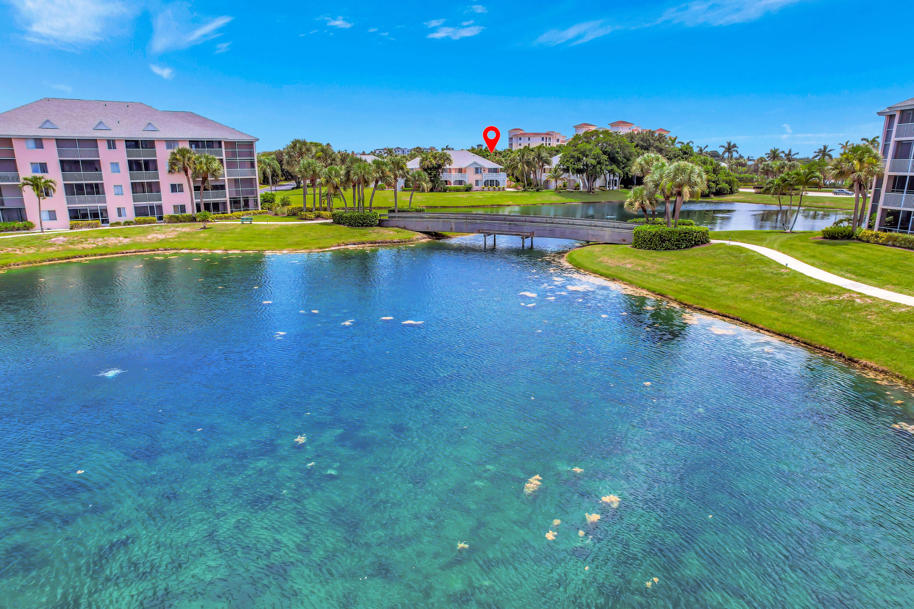 353 Highway 1, Unit A4 Jupiter, FL 33477 - Photo 50 of 51 a view of a lake with a house in the background