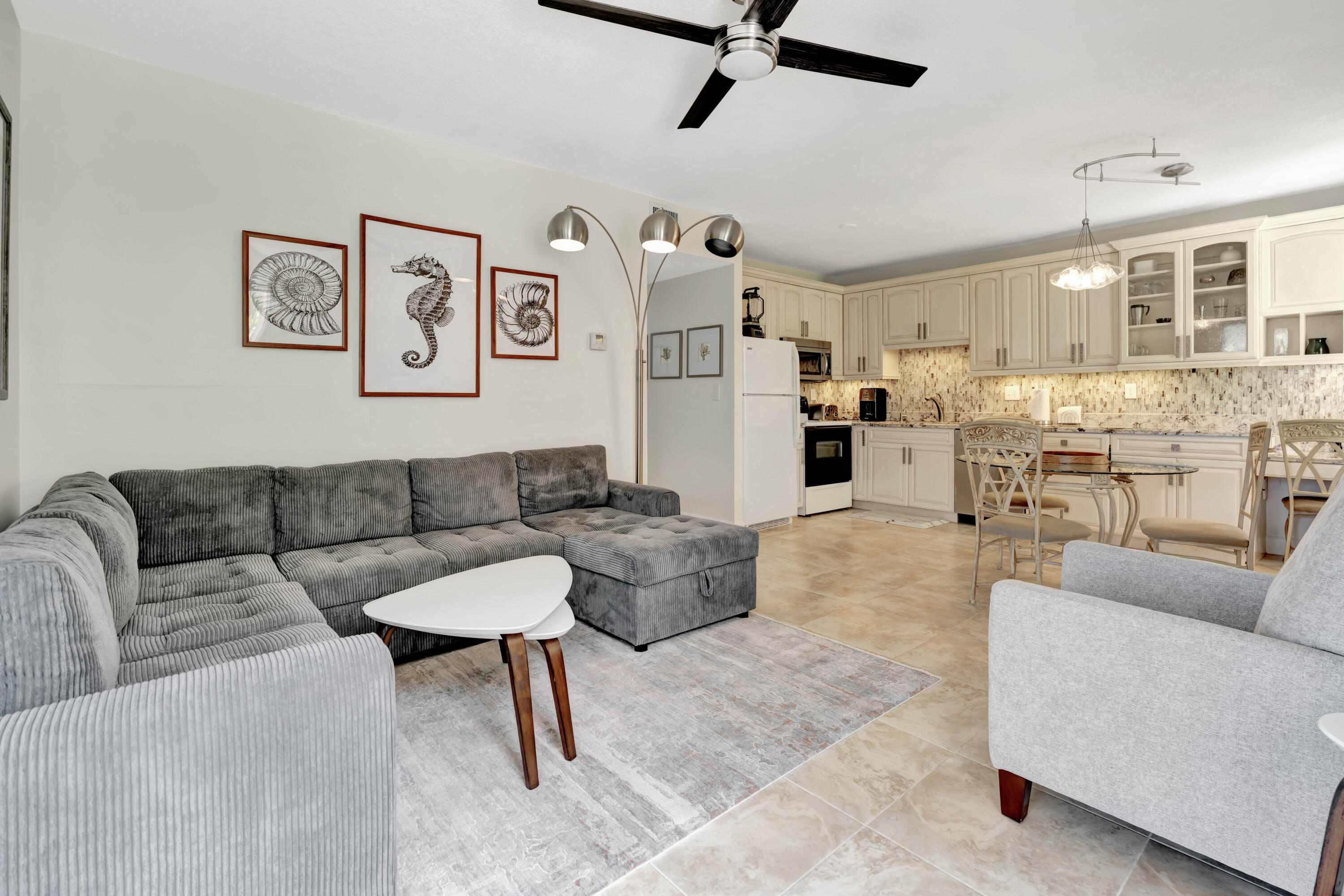 353 Highway 1, Unit A4 Jupiter, FL 33477 - Photo 10 of 51 a living room with furniture and a large window