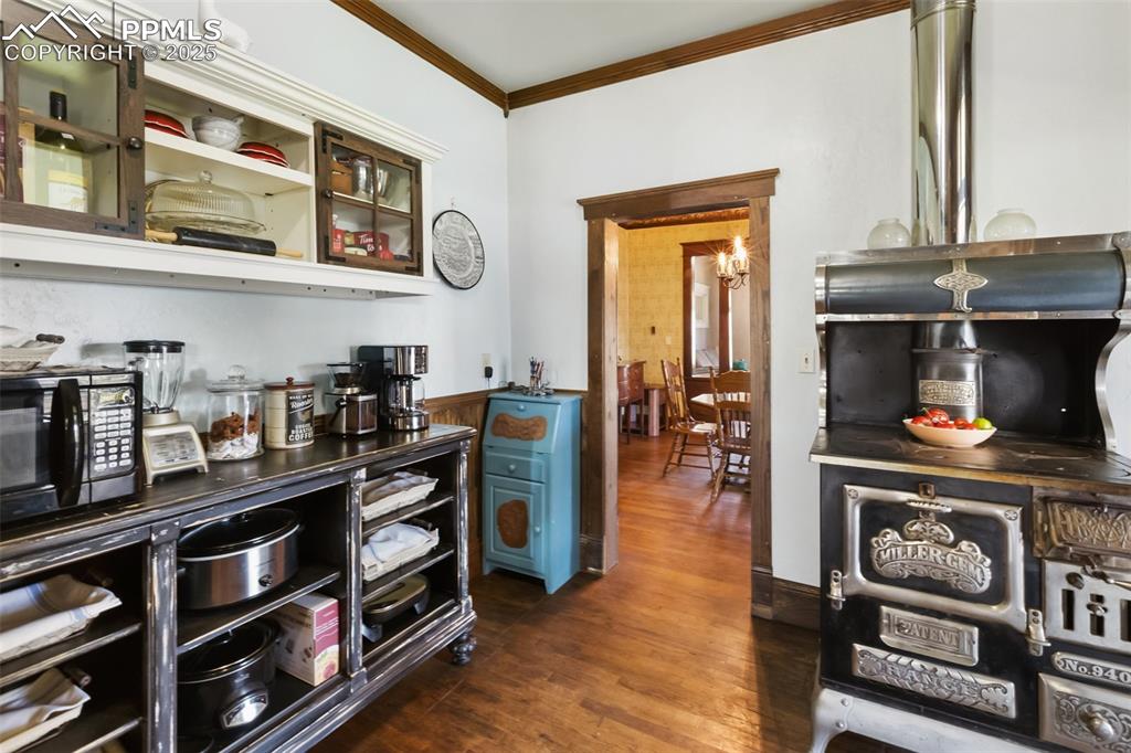 119 South 3rd Street Victor, CO 80860 - Photo 15 of 38 a kitchen with stainless steel appliances granite countertop a stove and a wooden cabinets