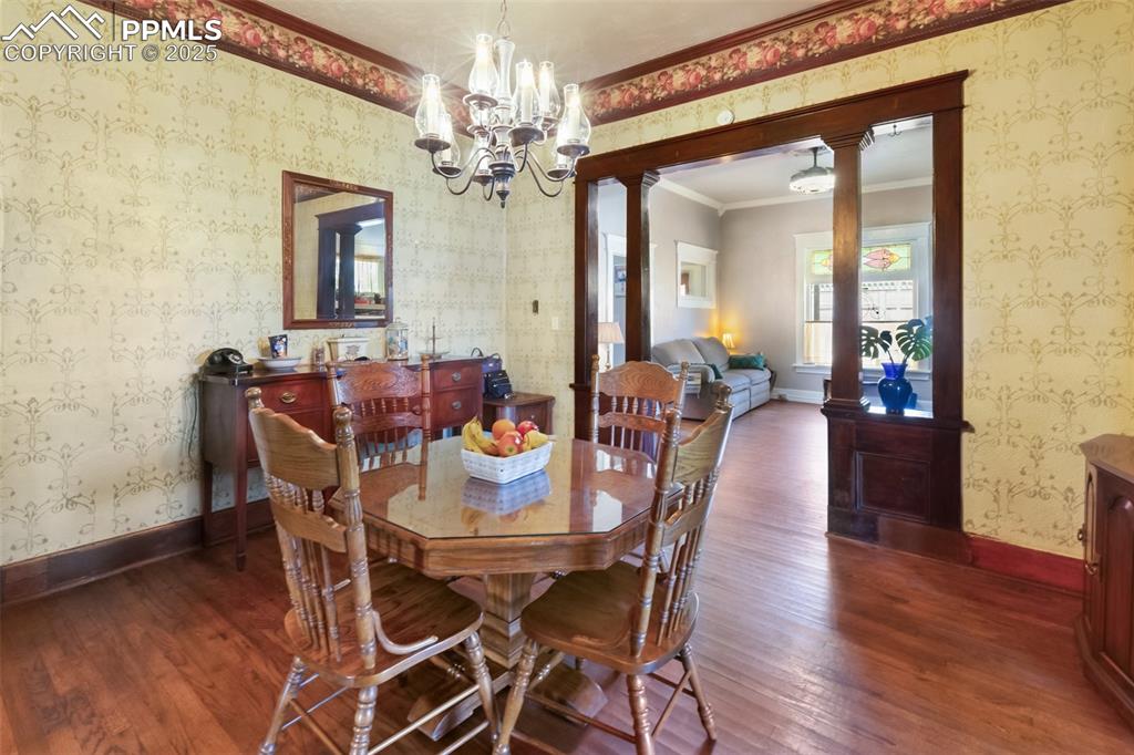 119 South 3rd Street Victor, CO 80860 - Photo 20 of 38 a view of a dining room with furniture and wooden floor