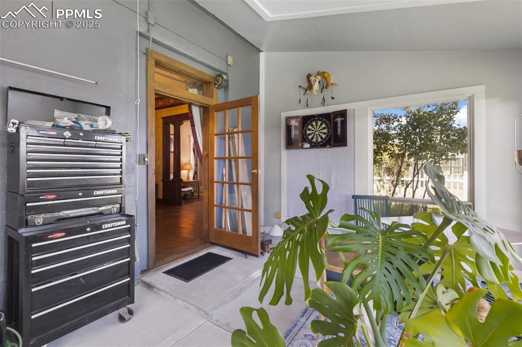 119 South 3rd Street Victor, CO 80860 - Photo 24 of 38 a living room filled with furniture and a potted plant