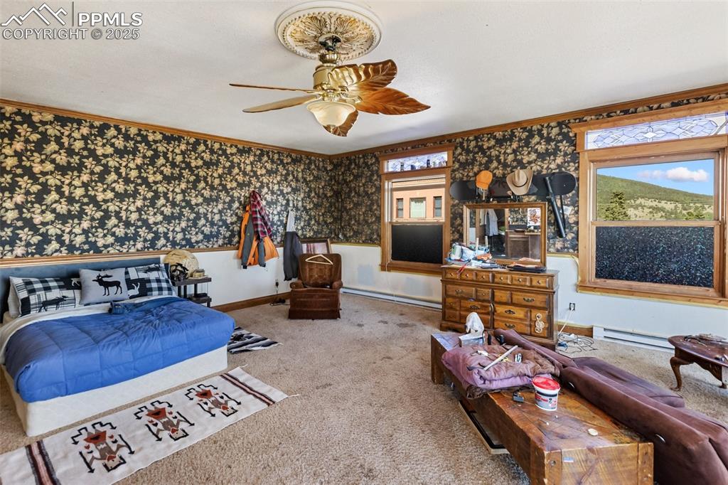 119 South 3rd Street Victor, CO 80860 - Photo 36 of 38 a living room with furniture and a flat screen tv