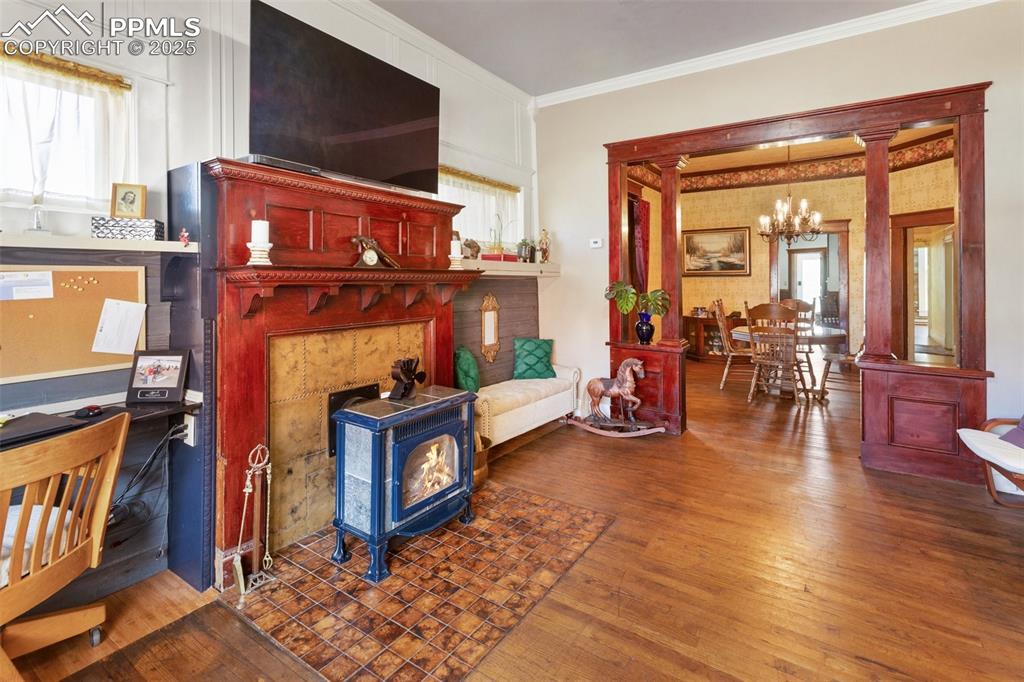 119 South 3rd Street Victor, CO 80860 - Photo 8 of 38 a living room with furniture a flat screen tv and floor to ceiling window