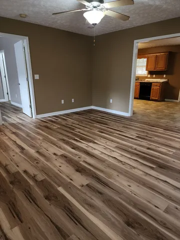 a view of a livingroom with wooden floor