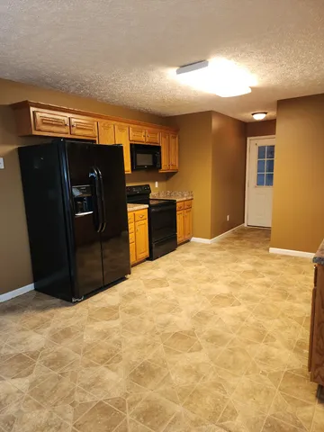 a view of a refrigerator in the kitchen