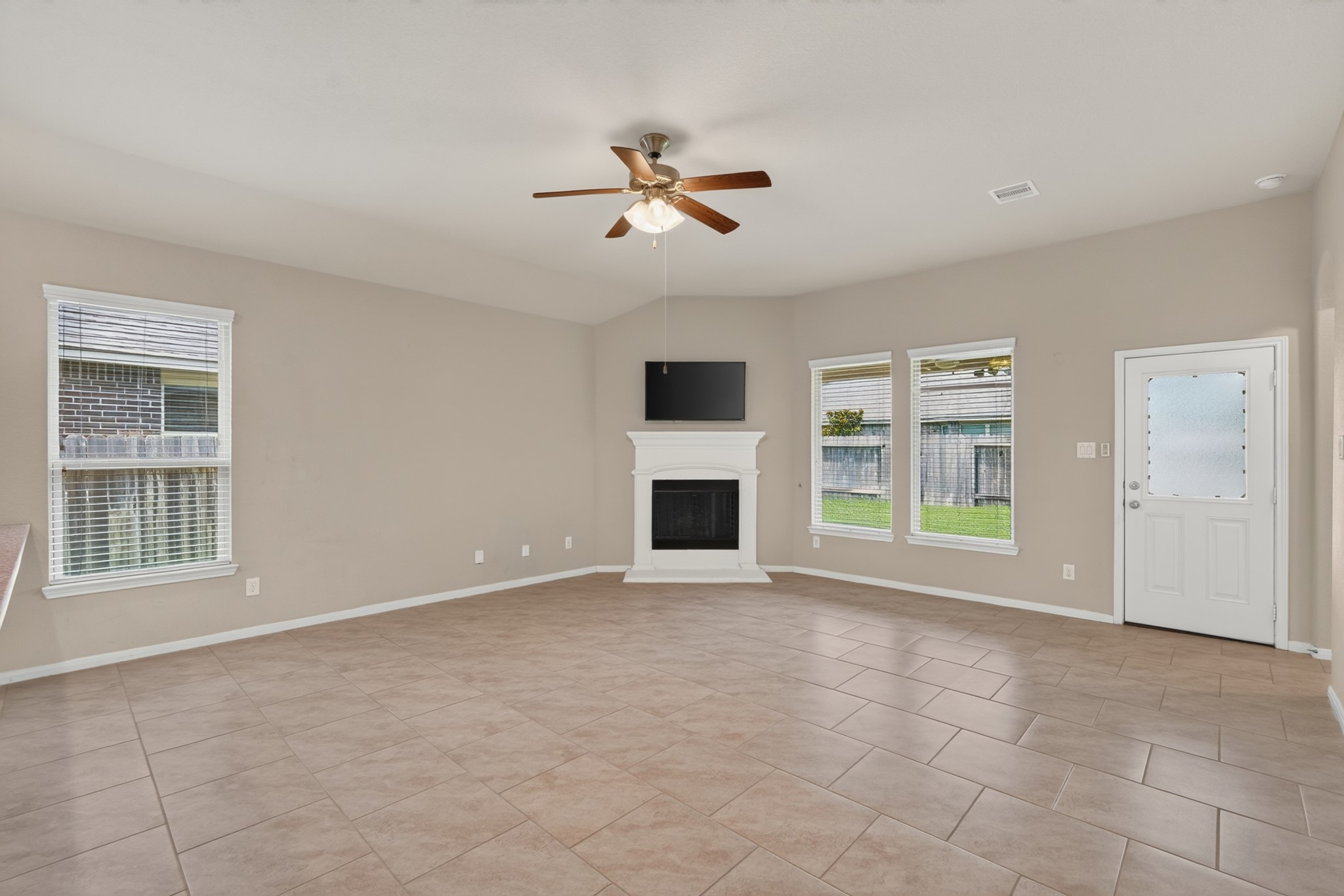 5414 Claymore Meadow Lane Spring, TX 77389 - Photo 16 of 35 View of the living room with Fireplace and lots of windows.